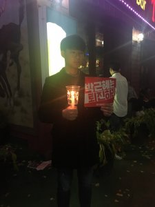 young man seoul demonstration